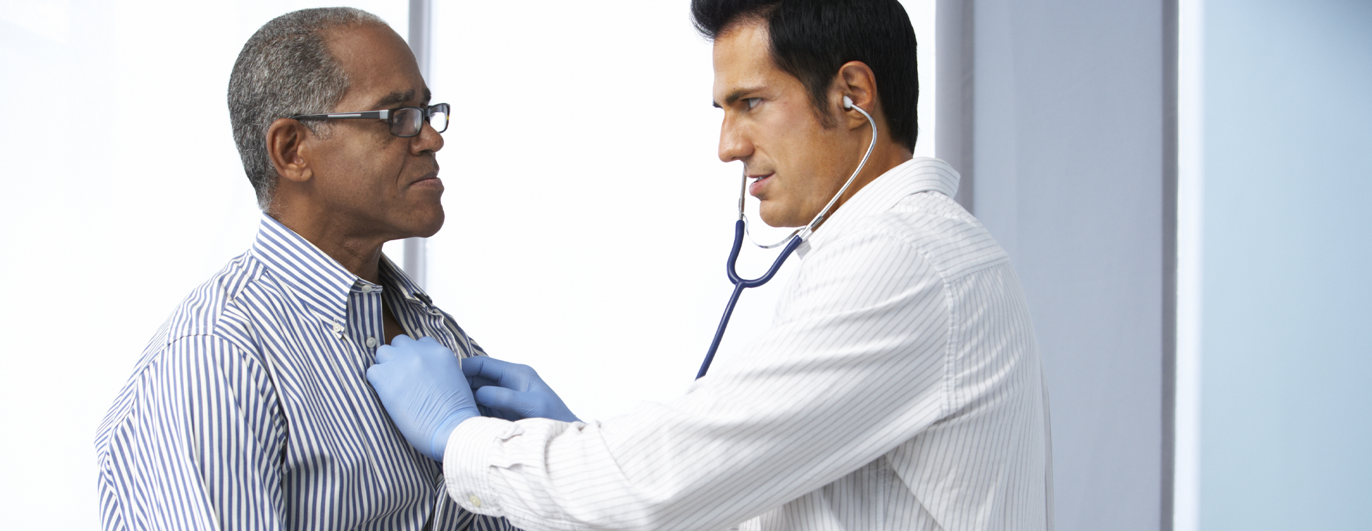 doctor checking heartbeat